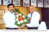 Dr. S. B. Sawant, Director AKIMSS felicitating Dr. M. N. Maldar Vice Chancellor Solapur University, 
